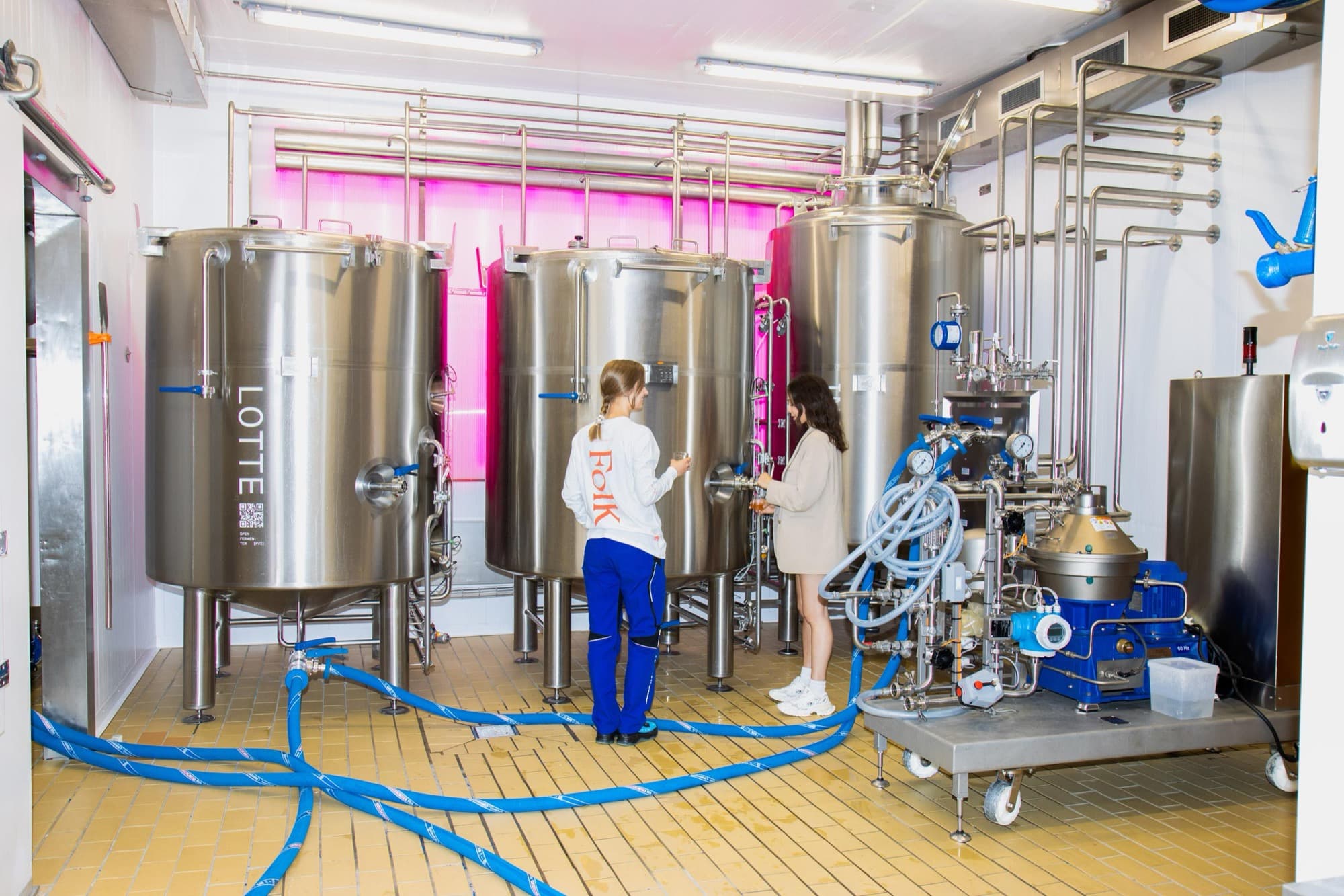 The Folk Kombucha brewery in Copenhagen with its fermentation tanks, the one on the left named Lotte